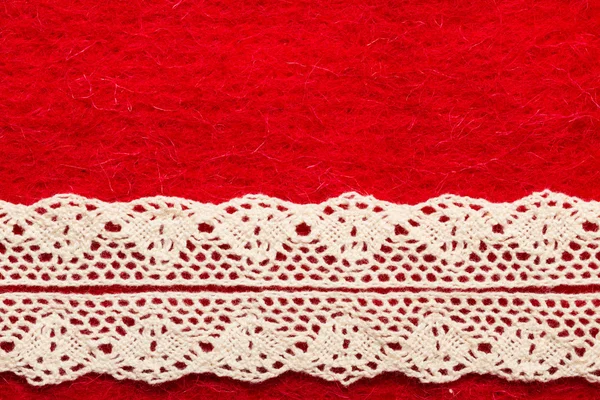 Vintage white lace over red background — Stock Photo, Image