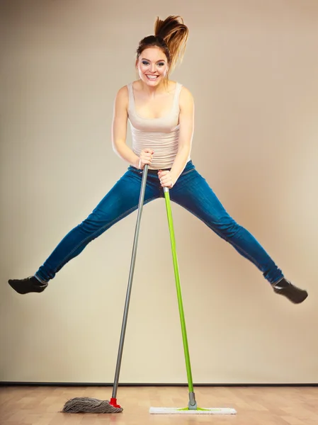 Funny cleaning woman mopping floor jumping — Stock Photo, Image