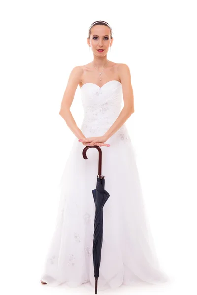 Full length bride in wedding gown holds umbrella — Stock Photo, Image