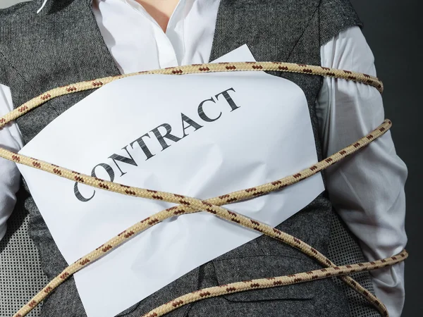 Businesswoman bounded by contract terms. — Stock Photo, Image