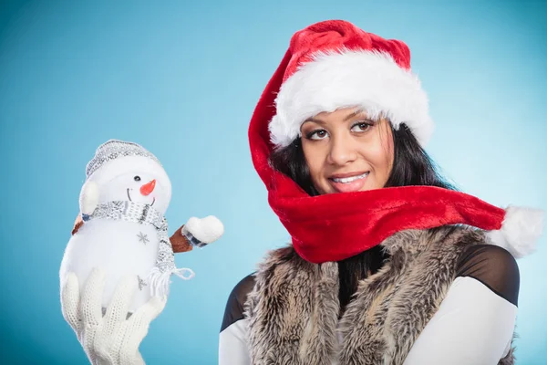 Woman  holding little snowman — Stock Photo, Image