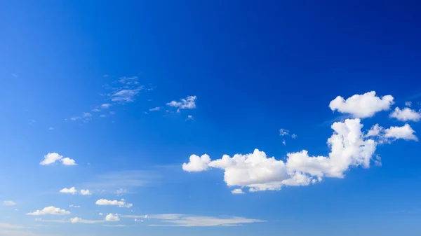 Deep blue sky background with clouds — Stock Photo, Image