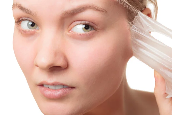 Girl removing facial peel off mask — Stock Photo, Image