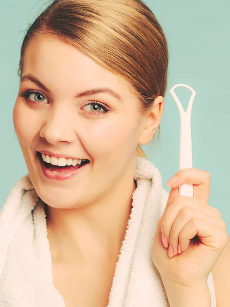 Girl with tongue cleaner. — Stock Photo, Image