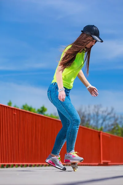 Teen girl skater riding skateboard on street. — Stock Photo, Image