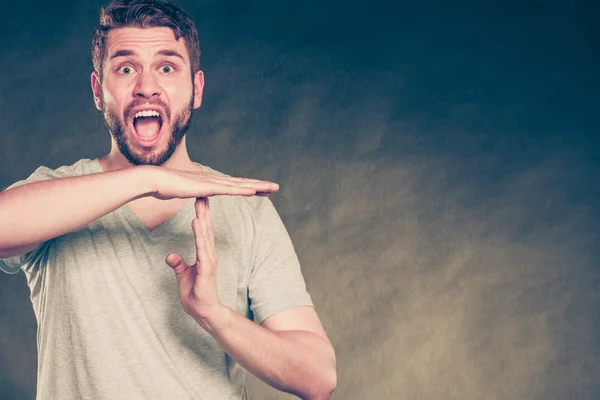 Man showing time out gesture sign and screaming. — Stok fotoğraf