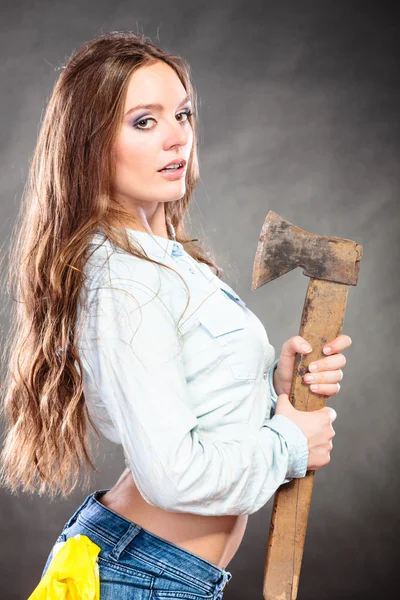 Woman holding axe Stock Photo