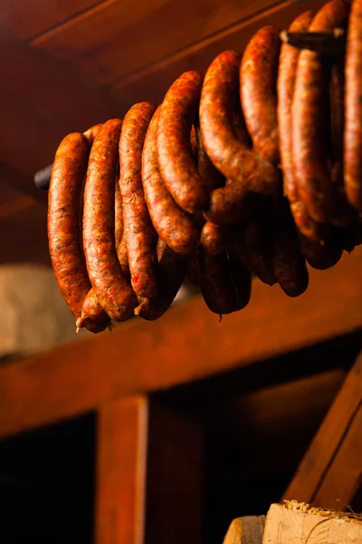 Traditional food. Smoked sausuages in smokehouse. — Stock Photo, Image