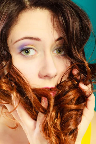 Closeup part of woman face long curly hair — Stock Photo, Image