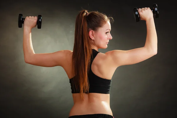 Fit woman exercising with dumbbells. — Stock Photo, Image