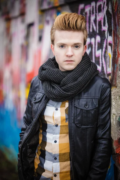 Fashion male portrait on graffiti wall — Stock Photo, Image