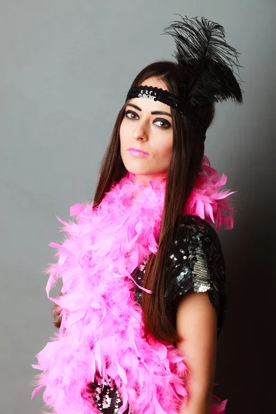 Girl pink plume and black feather on head. Carnival. — Stock Photo, Image