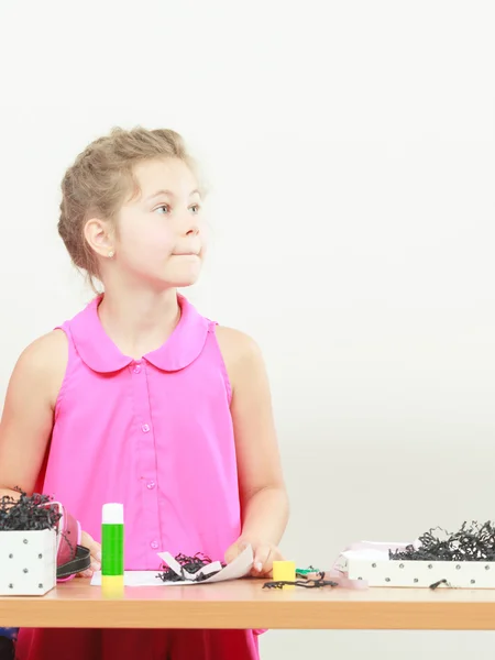 Little girl getting ideas in the classroom — Stock Fotó