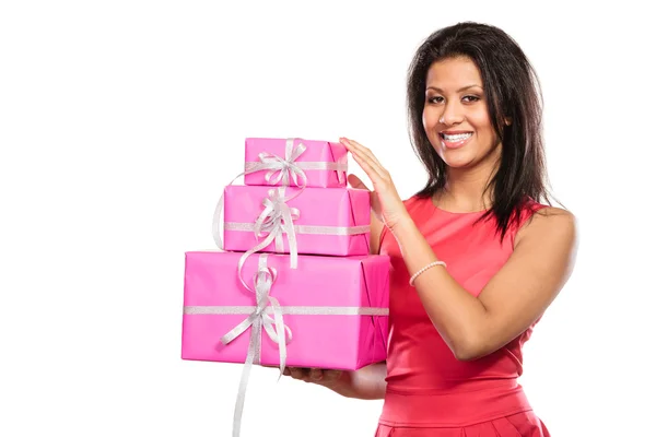 Chica sosteniendo pila de regalos — Foto de Stock