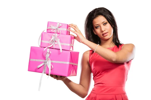 Girl holding stack of presents Stock Image