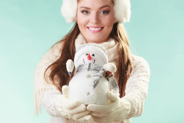 Woman holding little snowman. — Stock Photo, Image