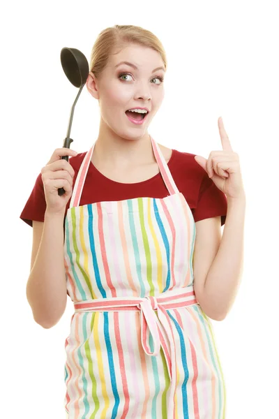 Housewife or cook chef in kitchen apron with ladle — Stock Photo, Image