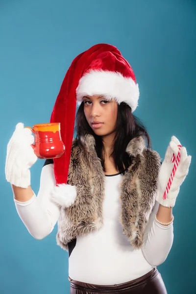 Winter girl santa helper hat holds red mug — Stock Photo, Image