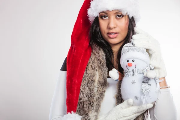 Woman holding little snowman. — Stock Photo, Image