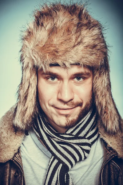 Happy man with half shaved face beard in fur hat. — Stock Photo, Image