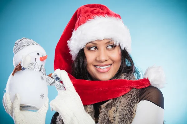 Woman  holding little snowman — Stock Photo, Image