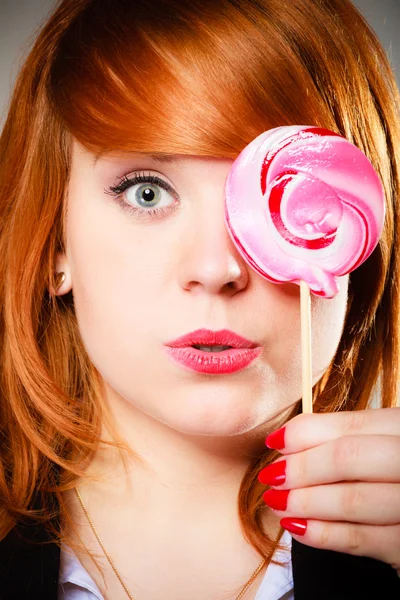 Redhair girl with pink lollipop — Stock Photo, Image