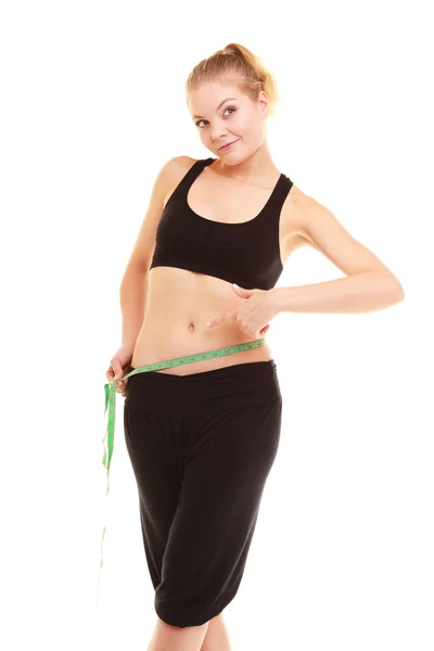 Diet. slim blonde girl with measure tape measuring waist — Stock Photo, Image