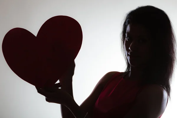 Woman with red heart card — Stock Photo, Image