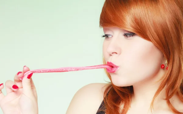 Woman holding candy — Stock Photo, Image