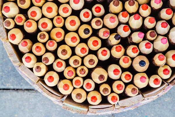 Pencils in basket pencil holder. Top view. — Stockfoto