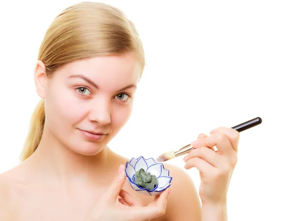 Woman applying clay mud mask — Stock Photo, Image