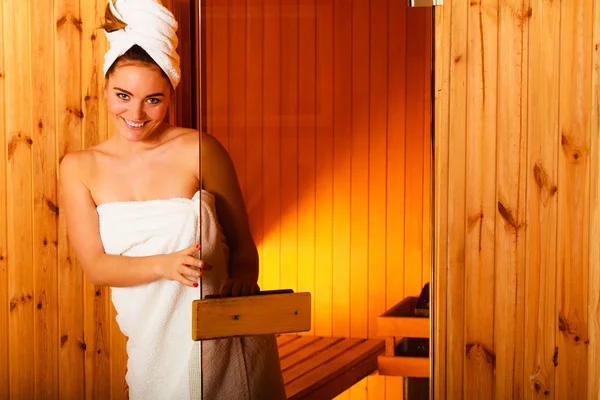 Woman relaxing in wooden sauna — Stock Photo, Image