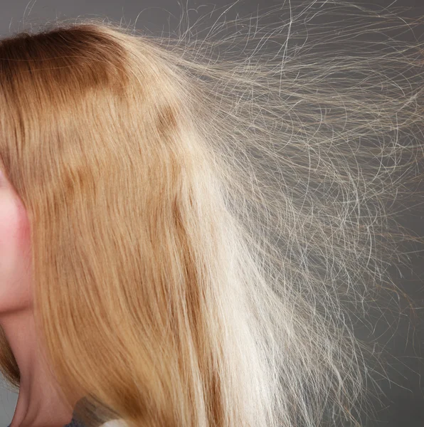 woman with static blonde hair.