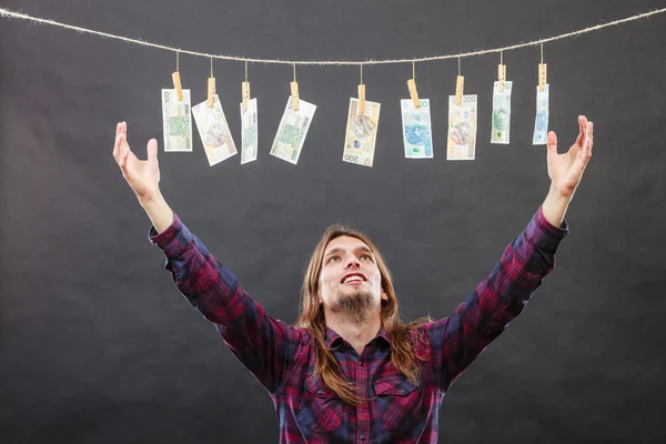 Rich man with laundry of money — Stock Photo, Image