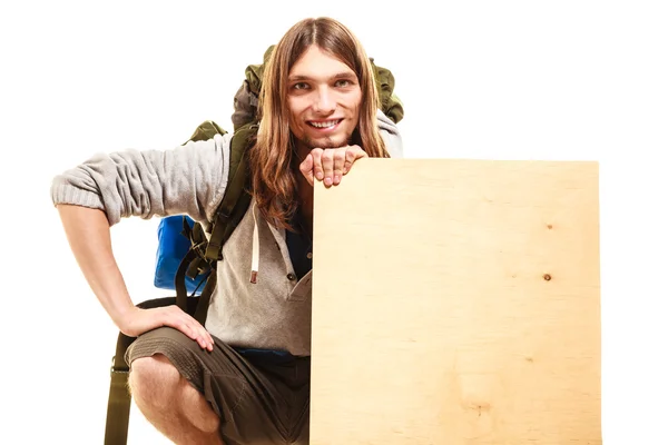 Backpacker holding banner — Stock Photo, Image