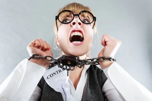 Furious woman with chained hands and contract