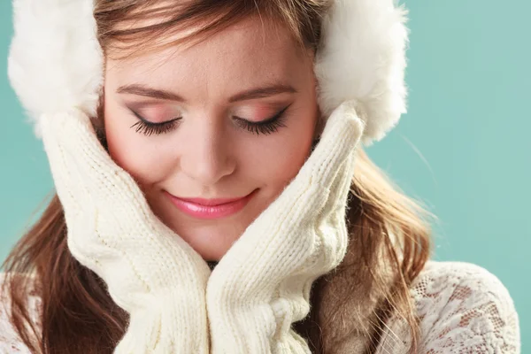 Woman in earmuffs smiling. — Stock Photo, Image