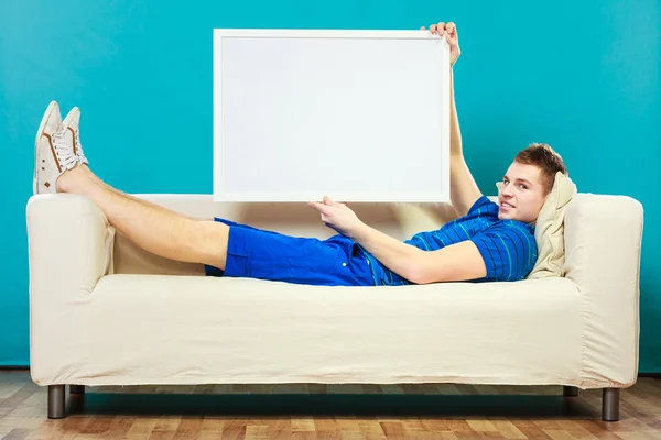 Man laying  with presentation board — Stock Photo, Image