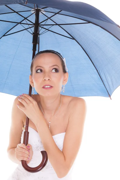 Bride woman hiding taking cover under umbrella — Stockfoto