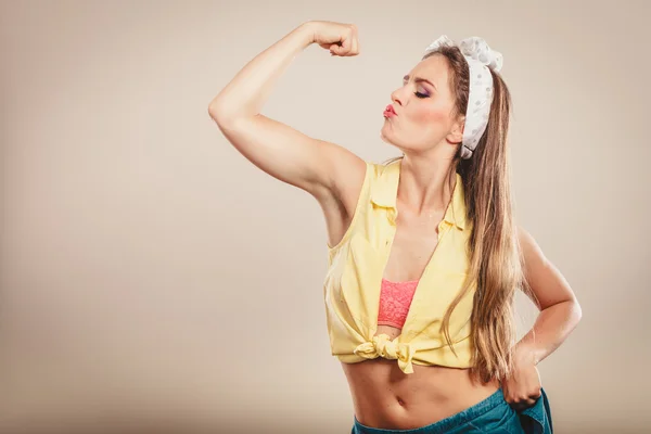 Girl showing off muscles — Stock Photo, Image