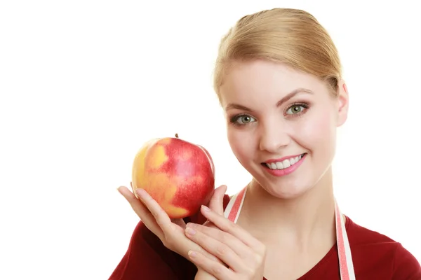 Housewife  offering red apple Stock Photo