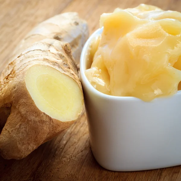 Ginger root and honey on wooden rustic table. — Stock Photo, Image