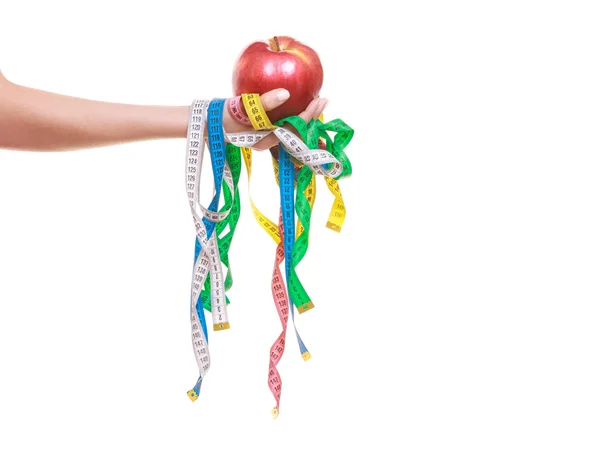 Closeup of human holding apple and tape measures. — 스톡 사진