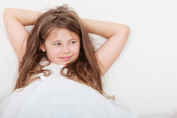 Happy little girl kid relaxing on sofa. — Stock Photo, Image