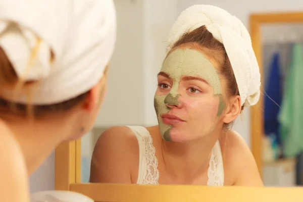 Woman removing mud mask — Stock Photo, Image