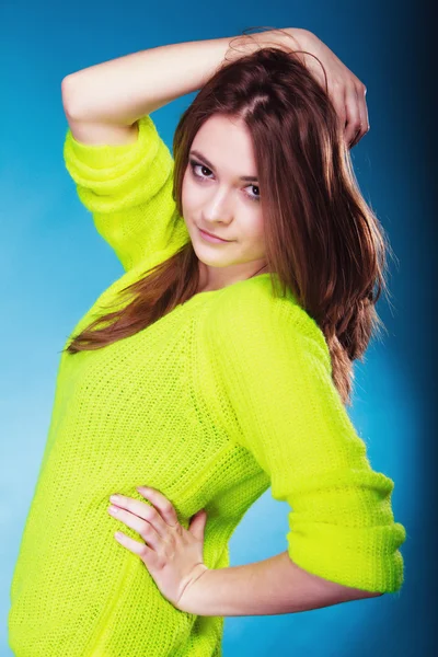 Portrait teen girl in vivid colour sweater on blue — Stock Photo, Image
