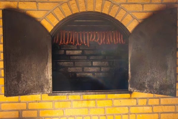 Traditional food. Smoked sausuages in smokehouse. — Stock Photo, Image