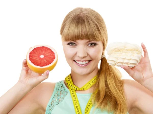 Woman choosing fruit or cake make dietary choice — Stock Photo, Image