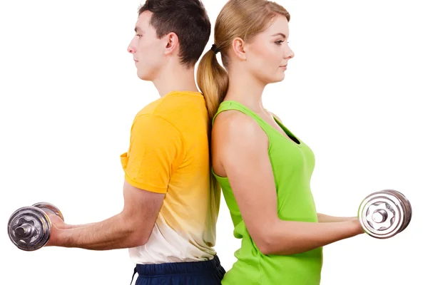 Couple exercising with dumbbells lifting weights — Stock Photo, Image