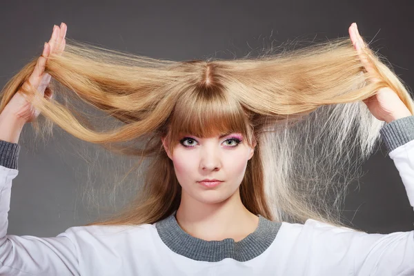 Woman holding long hair — Stock Photo, Image